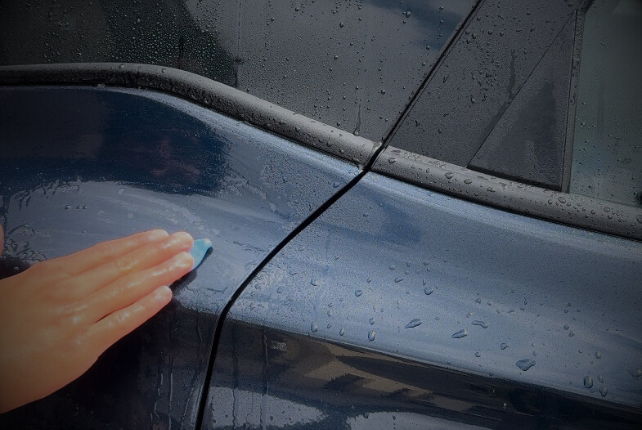 Clay Bar Process on a SUV to remove embedded contaminants from paintwork.