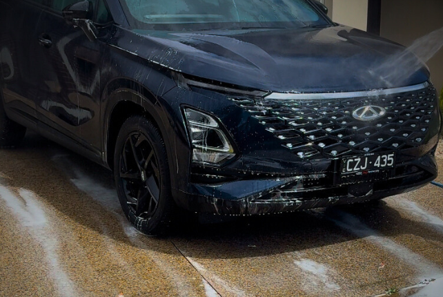 Car being heavily decontaminated prior to ceramic coating