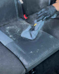 Steam cleaning of a dirty car seat in progress in Truganina, offering premium interior detailing services near Werribee.
